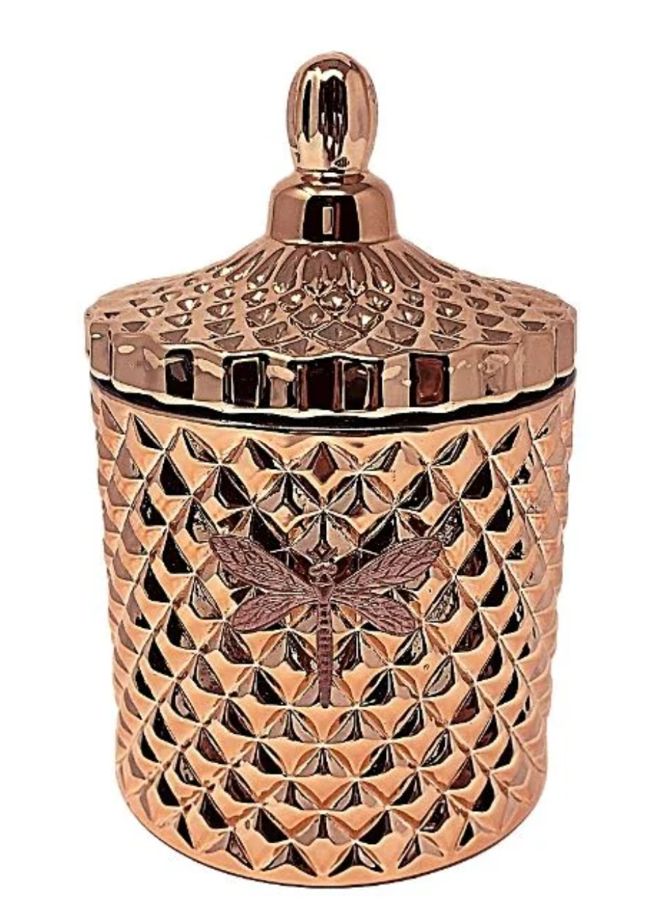 Decorative copper container with intricate patterns on a white background